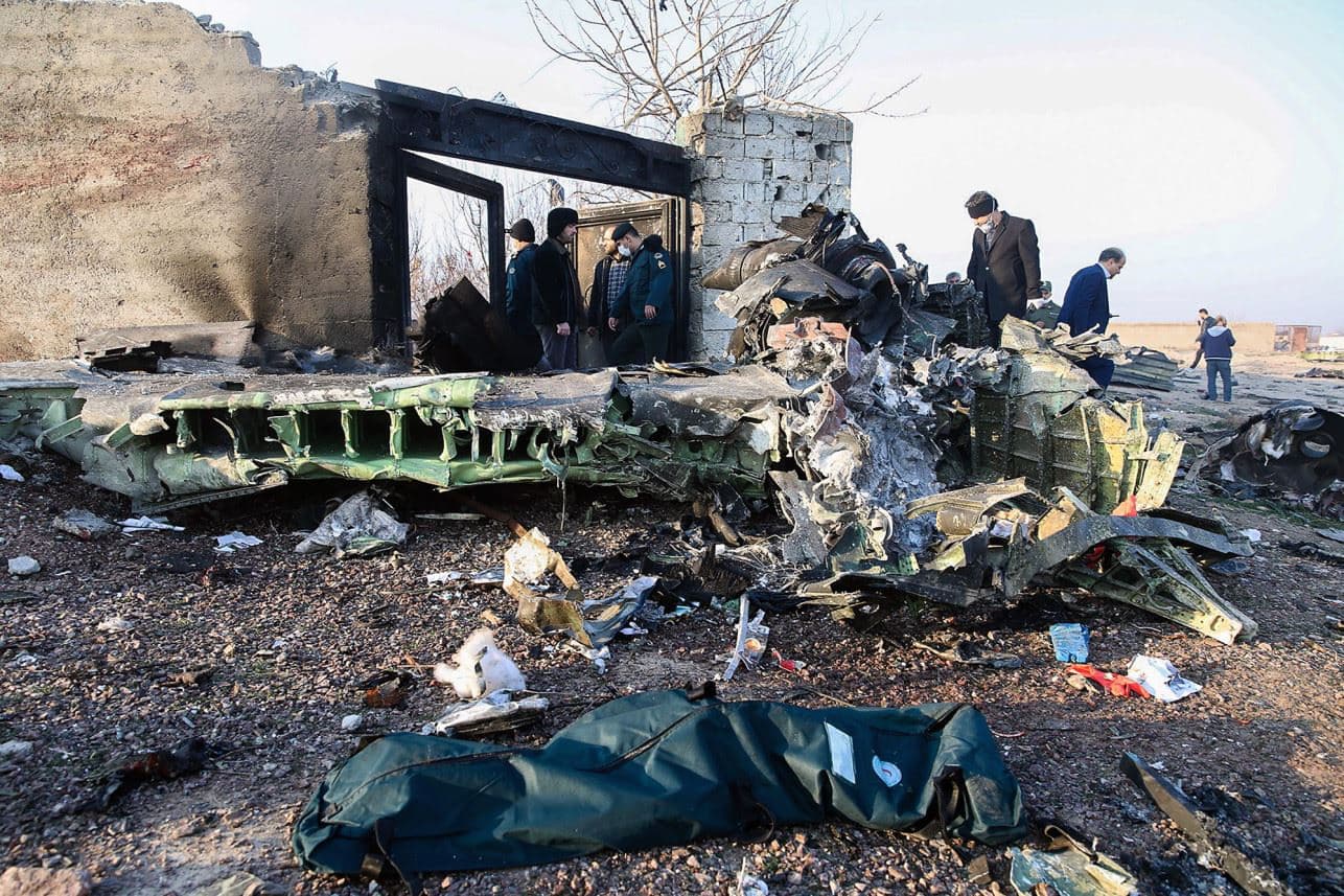 People stand near the wreckage of flight PS752 near Tehran. File photo: AFP