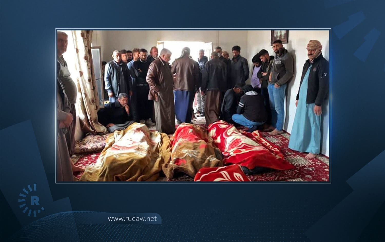 Mourners gather around the bodies of six members of one family gunned down in Tikrit on March 12, 2021. Photo: Handout/Iraqi forces