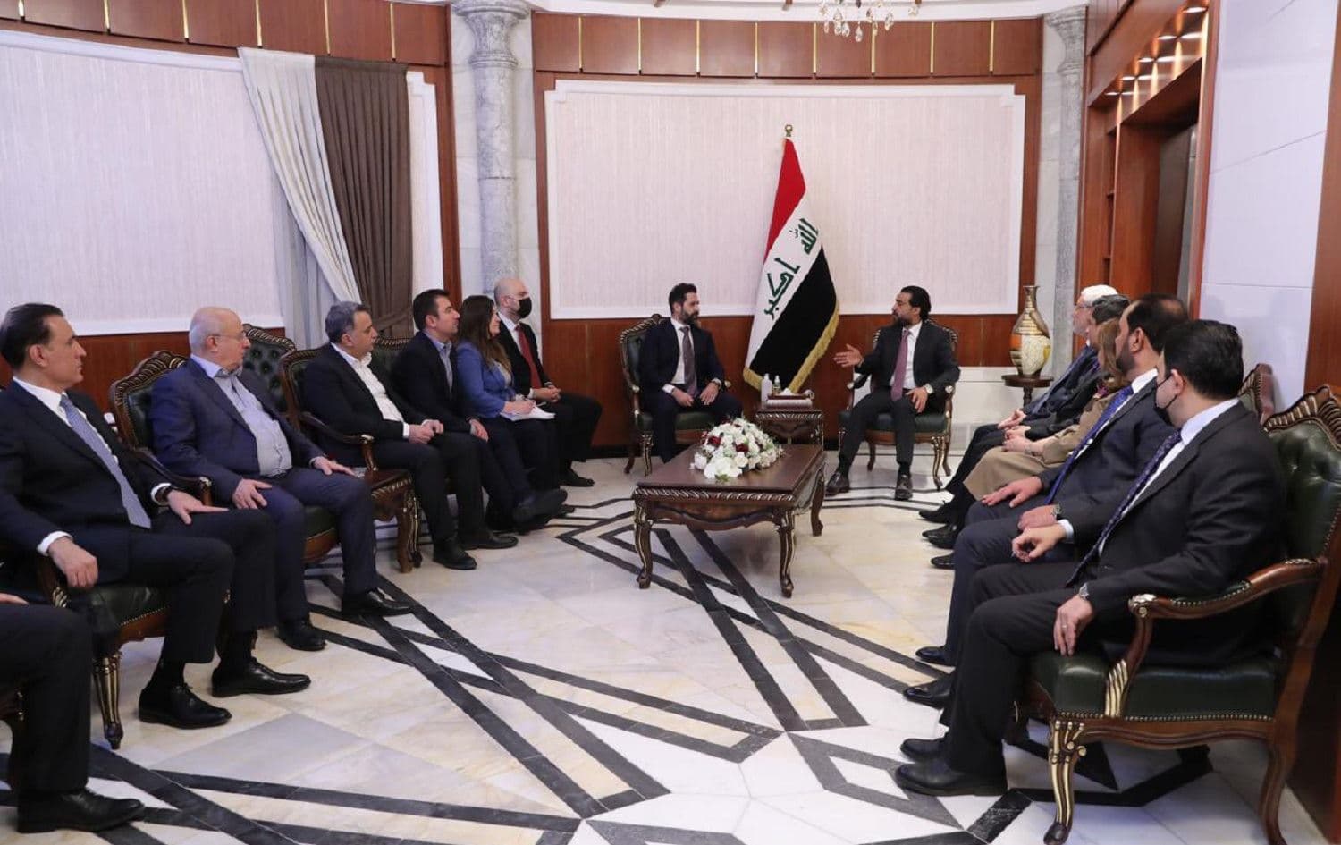 Kurdistan Region Deputy Prime Minister Qubad Talabani (centre left) talks with Iraqi Parliament Speaker Mohammed al-Halbousi (centre right) in Baghdad on March 19, 2021. Photo: handout/parliament speaker’s office