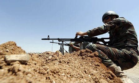 A Peshmerga soldier on the frontlines, where the Kurdish forces and Islamic militants are only a mile apart.  Photo: AFP 