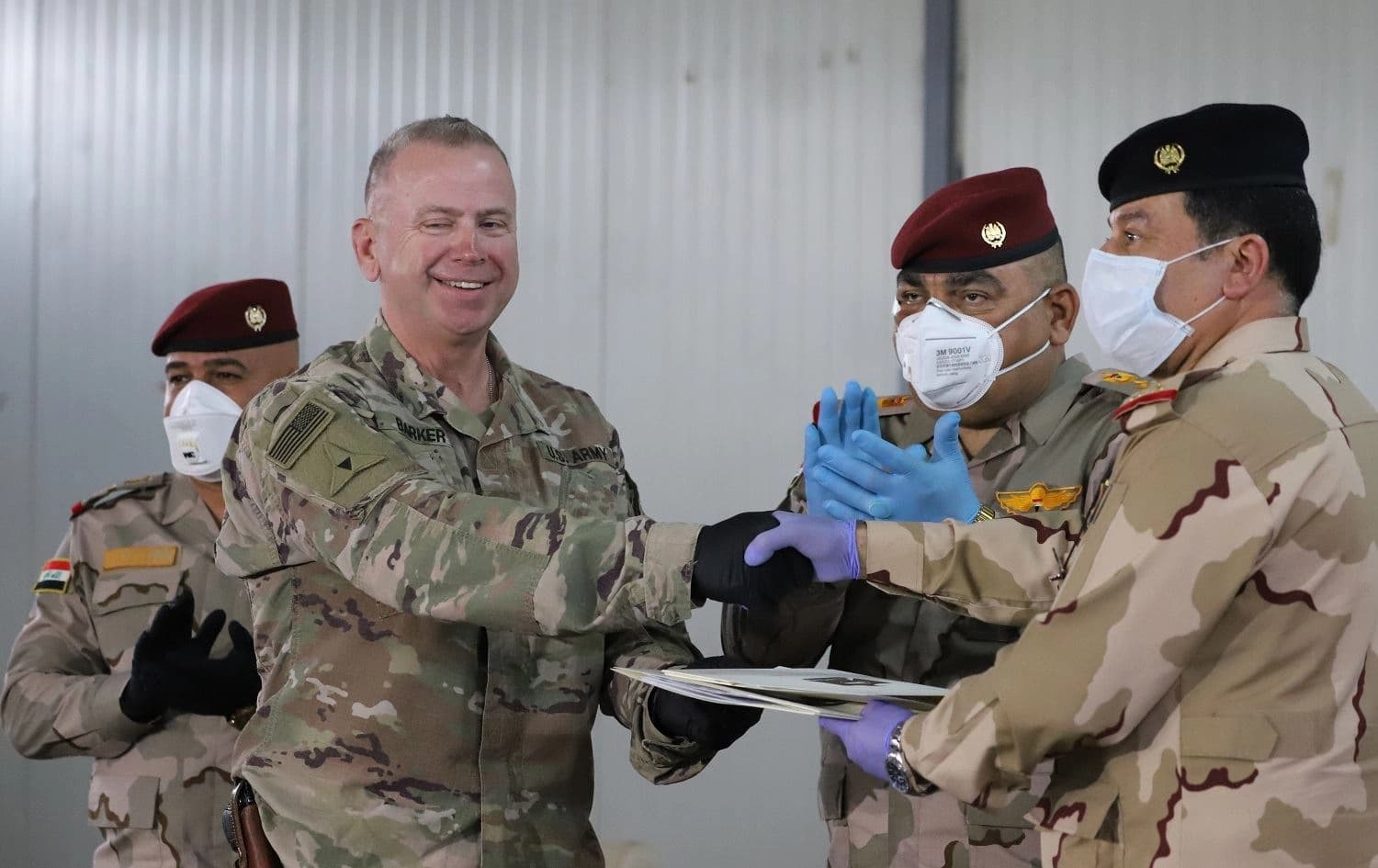 American and Iraqi commanders shake hands at the US hands over the coalition area of Kirkuk’s K-1 Air Base to Iraqi security forces on March 29, 2020. File photo: Fazel Hawramy/Rudaw