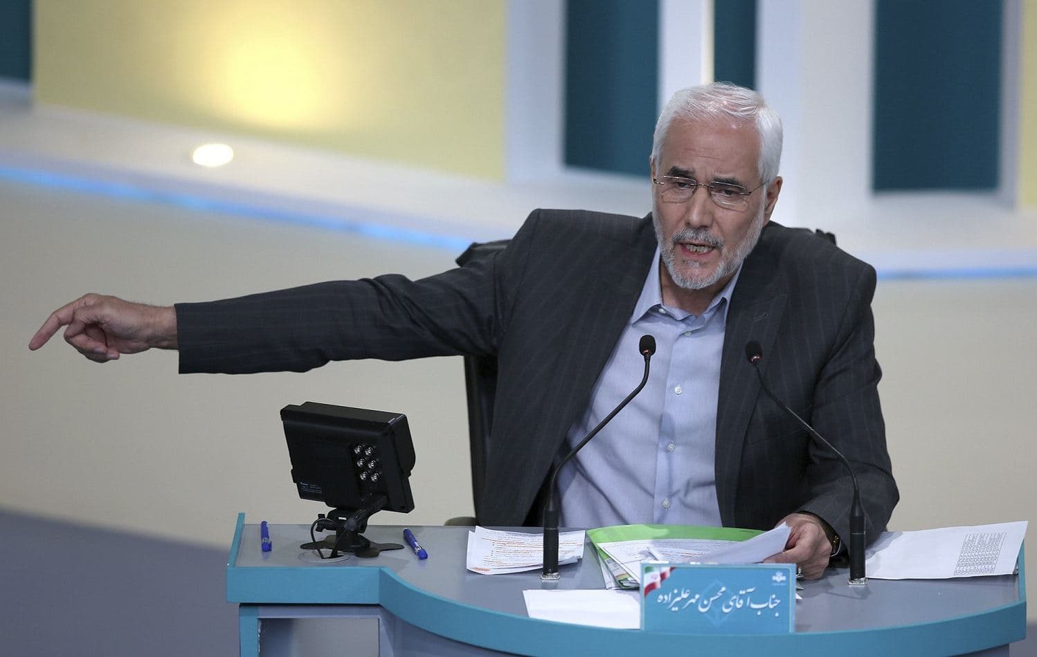 Mohsen Mehralizadeh speaks in the final debate of the candidates at a state-run TV studio in Tehran, Iran on Saturday, June 12 2021. Photo: AP