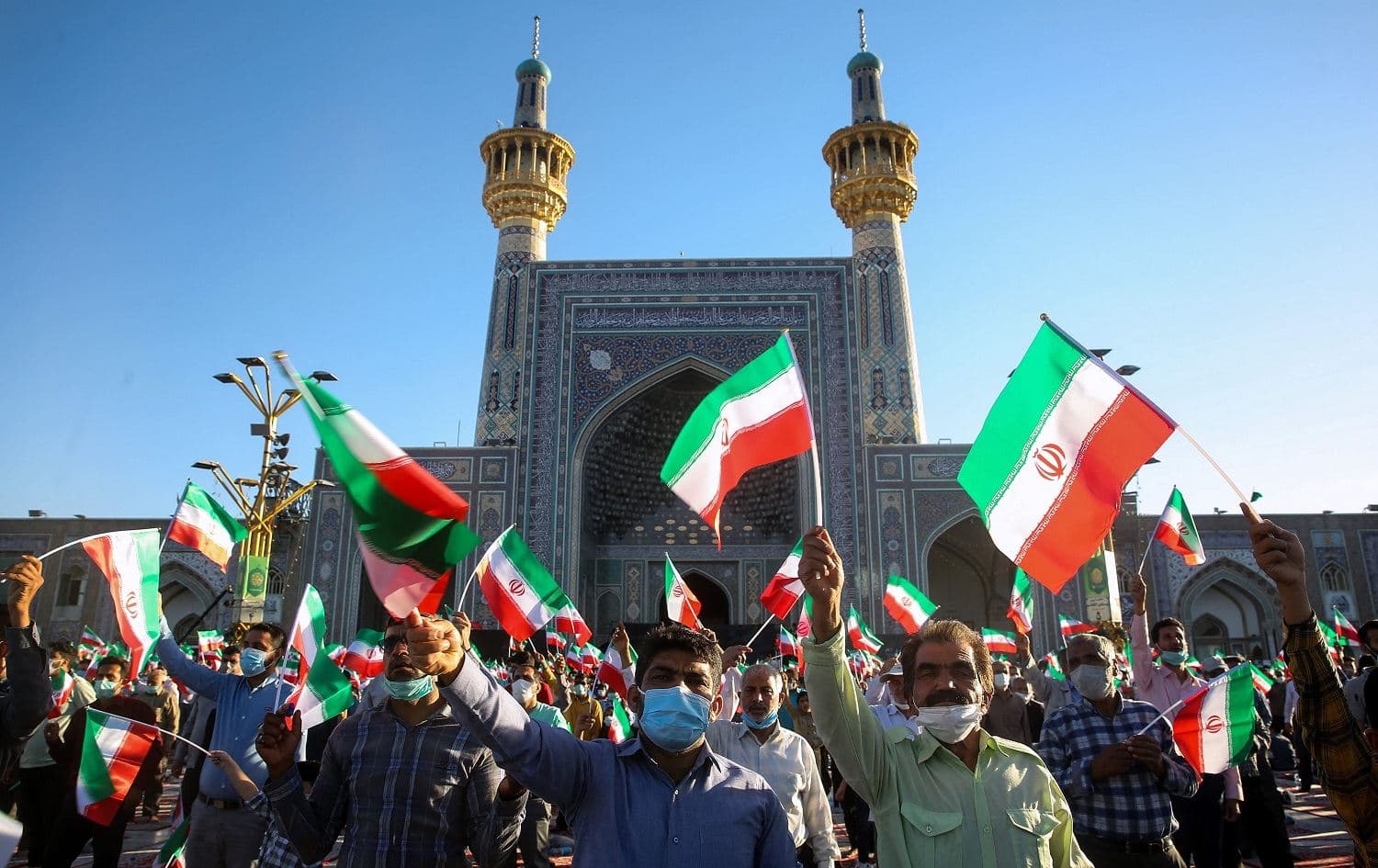 Supporters of Iran's President-elect Ebrahim Raisi cheer at the Imam Reza shrine in Mashhad, Iran on June 22, 2021. Photo: Mohsen Esmaeilzadeh/ISNA/AFP