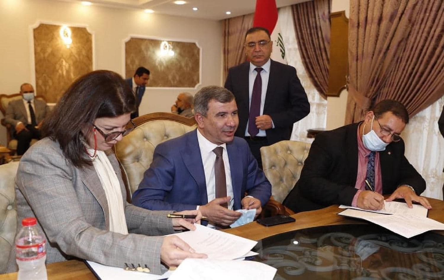 Officials sign the agreement on solar energy production on June 24, 2021. Photo: Ministry of Oil/Facebook