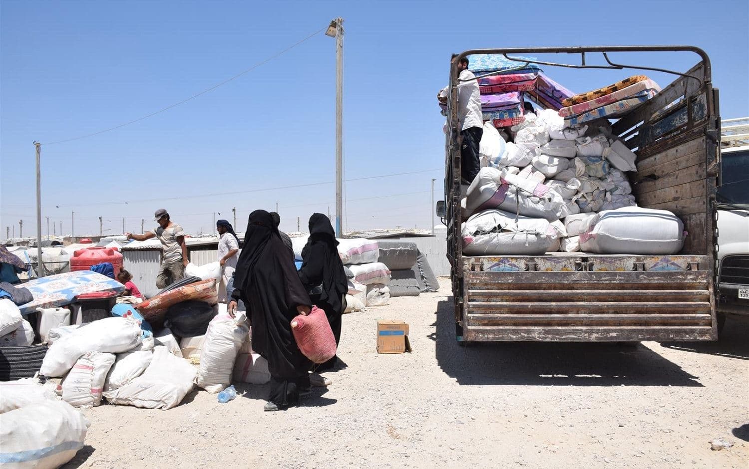 ISIS-affiliated families leave al-Hol camp on July 15, 2021. Photo: ANHA