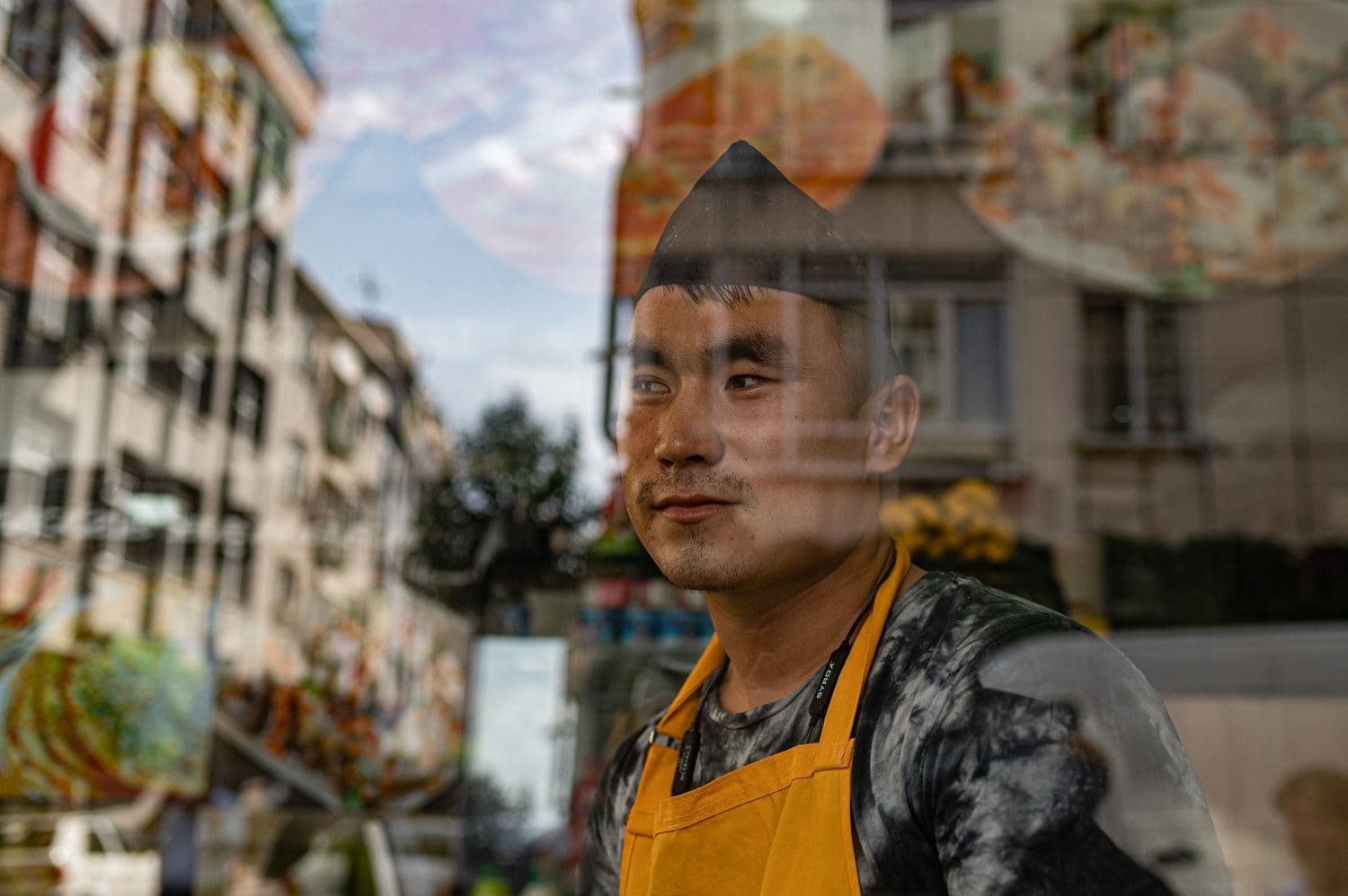 Ghawsuddin Mubariz, 20 year-old, who came from Afghanistan 2 years ago, works in a Fast food restaurant in Istanbul's Zeytinburnu district, on August 27, 2021. Photo: Yasin Akgul / AFP