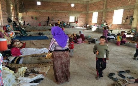 Homeless Yezidi families at a makeshift shelter in Khanki. Photo by author.
