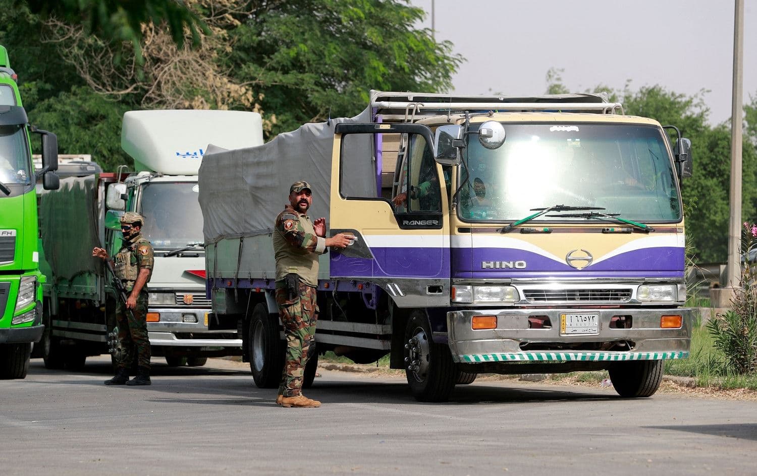 Iraqi security forces escorting malfunctioning electoral boxes arrive at Baghdad's Green Zone on October 13, 2021, where they will be manually counted. Photo: Ahmad al-Rubaye/AFP
