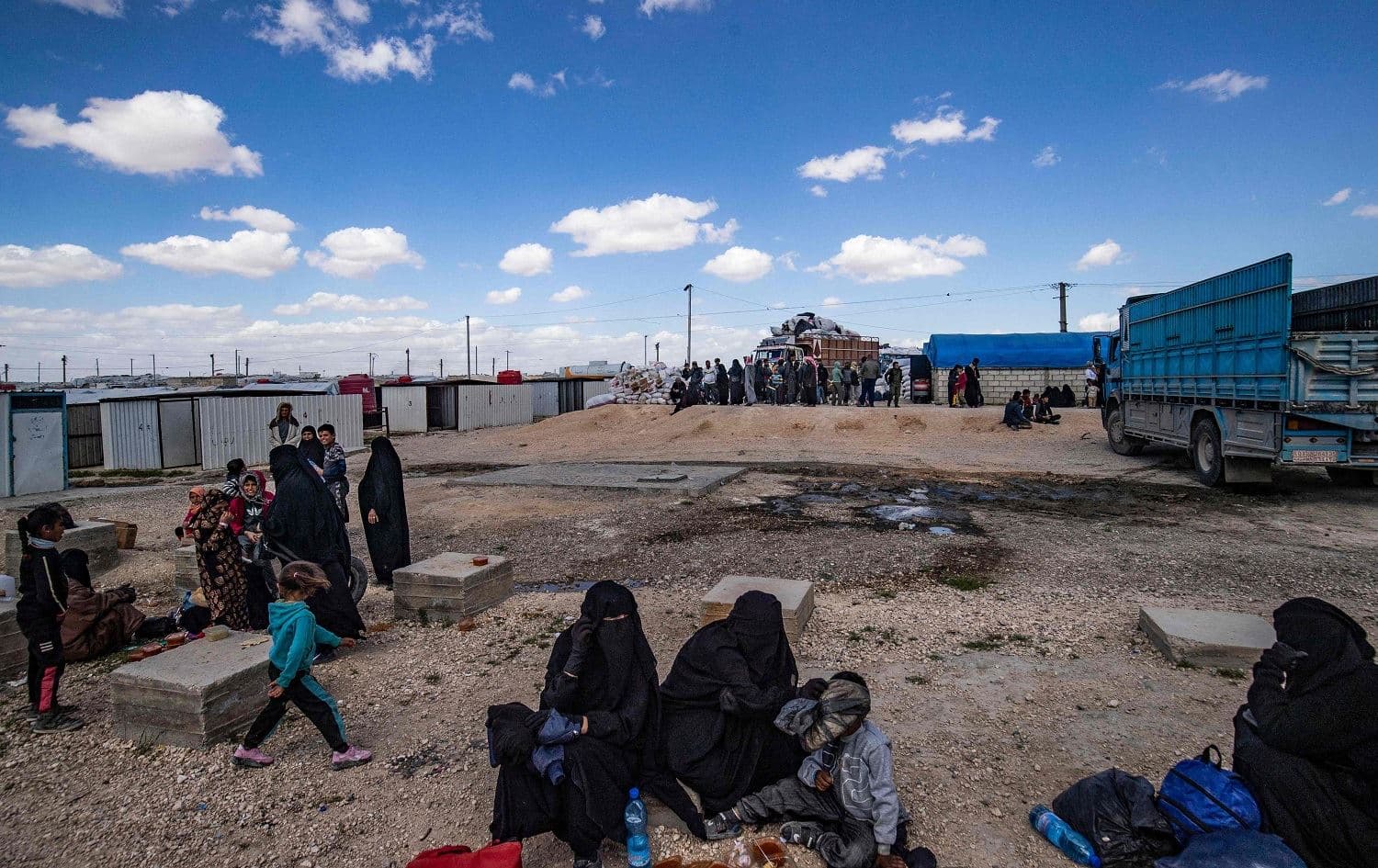 Syrian women and children await to leave al-Hol camp in northeast Syria on March 18, 2021. Photo: Delil Souleiman/AFP