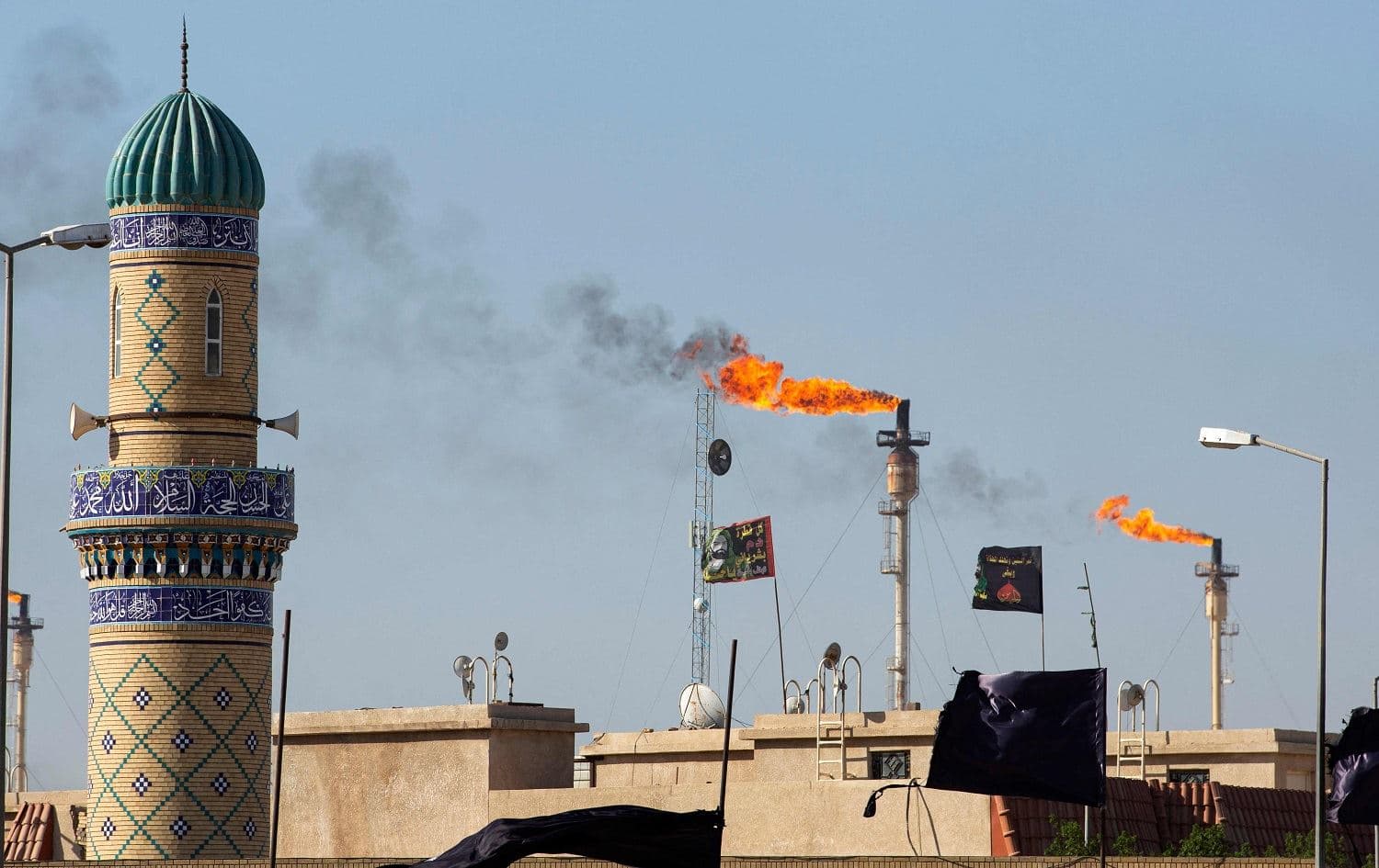 Flare stacks burn off excess gas at the Basra Gas company at Khor al-Zubair city in Basra governorate on September 21, 2021. File photo: Hussein Faleh/AFP