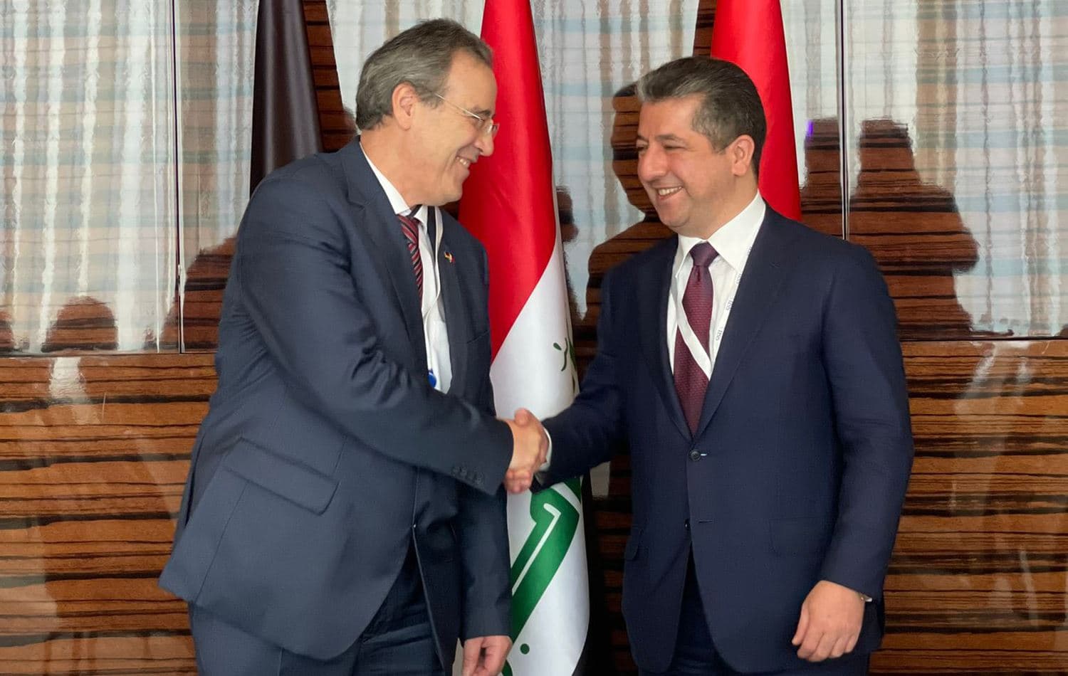 State Secretary of the Federal Foreign Office Miguel Berger (left) shakes hands with Kurdistan Region Prime Minister Masrour Barzani (right) in Manama, Bahrain on November 20, 2021. Photo: handout/Miguel Berger Twitter