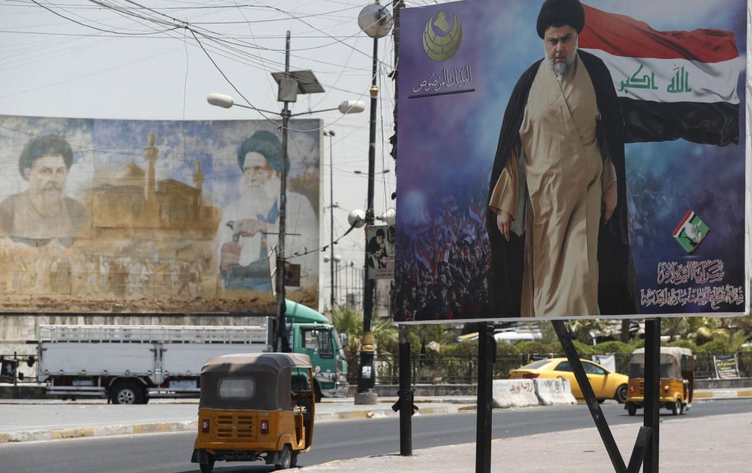 A poster of Iraq's populist Shia cleric Muqtada al-Sadr, in Sadr City, east of the capital Baghdad, on 15 July 2021. Photo: AFP