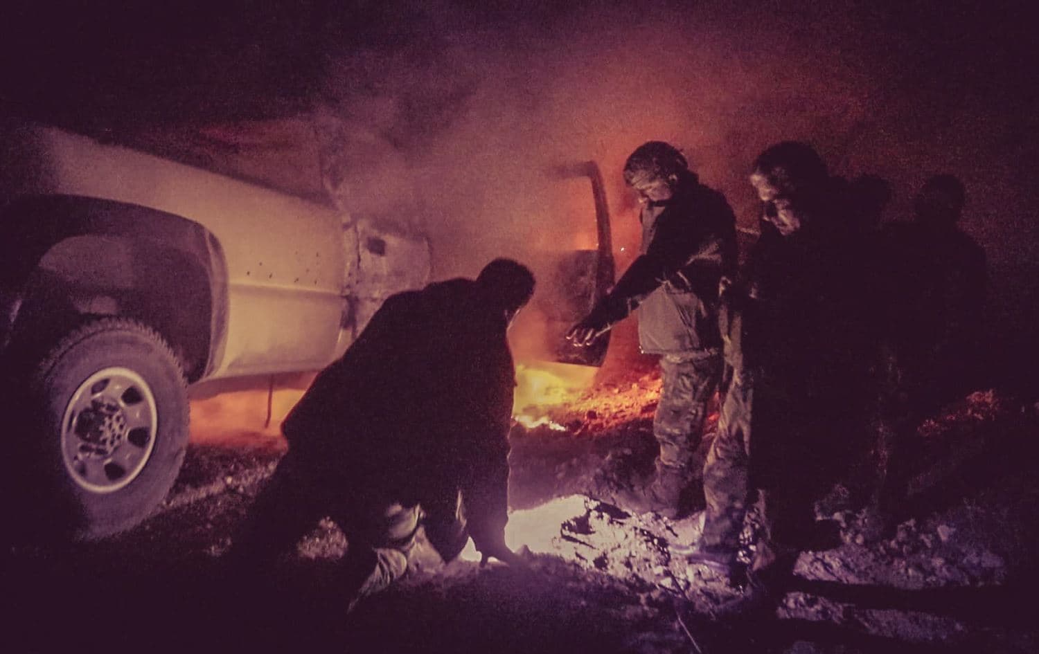 Peshmerga fighters are near one of their vehicles in Makhmour after being attacked by ISIS. Date: December 2, 2021. Photo: handout/Sirwan Barzani
