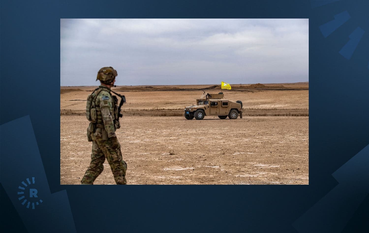 A US soldier walks near a humvee of the SDF during a joint military patrols between the SDF and anti-ISIS coalition in Deir ez-Zor on December 7, 2021. Photo: AFP