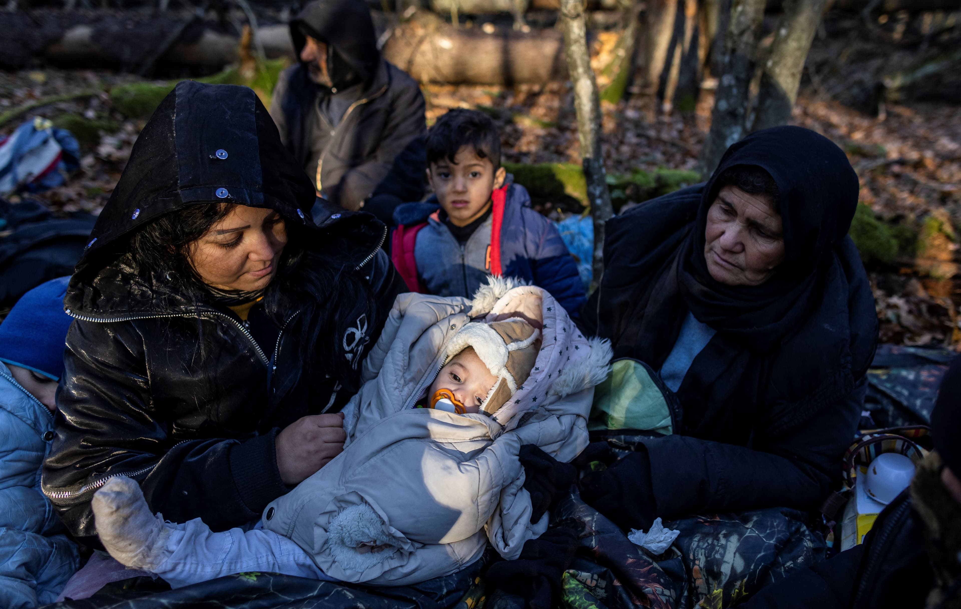 A Kurdish family from Dohuk in the Kurdistan Region photographed on the Belarus border near Narewka, Poland, on November 9, 2021. Photo: Wojtek Radwanski / AFP