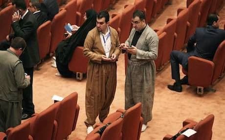 Kurdish MPs talking in parliament. Photo: AP