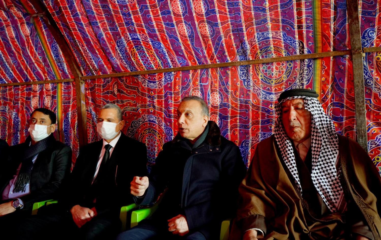 Iraqi PM Mustafa al-Kadhimi speaks to the family of the 20 victims during their mourning ceremony in Babil province. Date: January 5, 2022. Photo: handout
