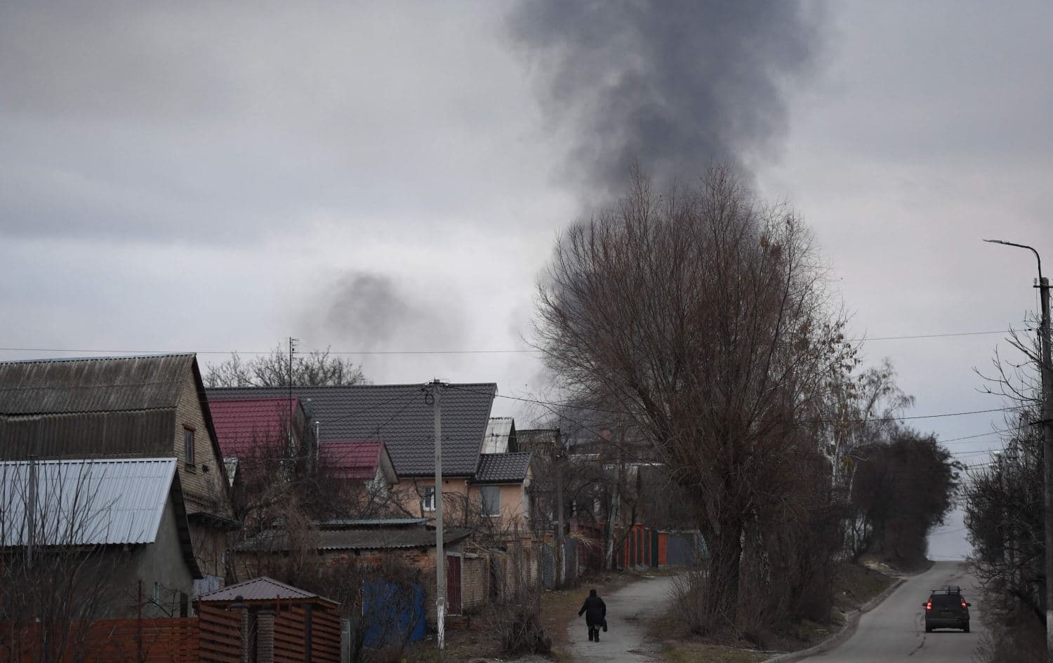 Smoke rising near the town of Hostomel and the Antonov Airport, in northwest Kyiv on February 24, 2022. Photo: Daniel Leal/AFP