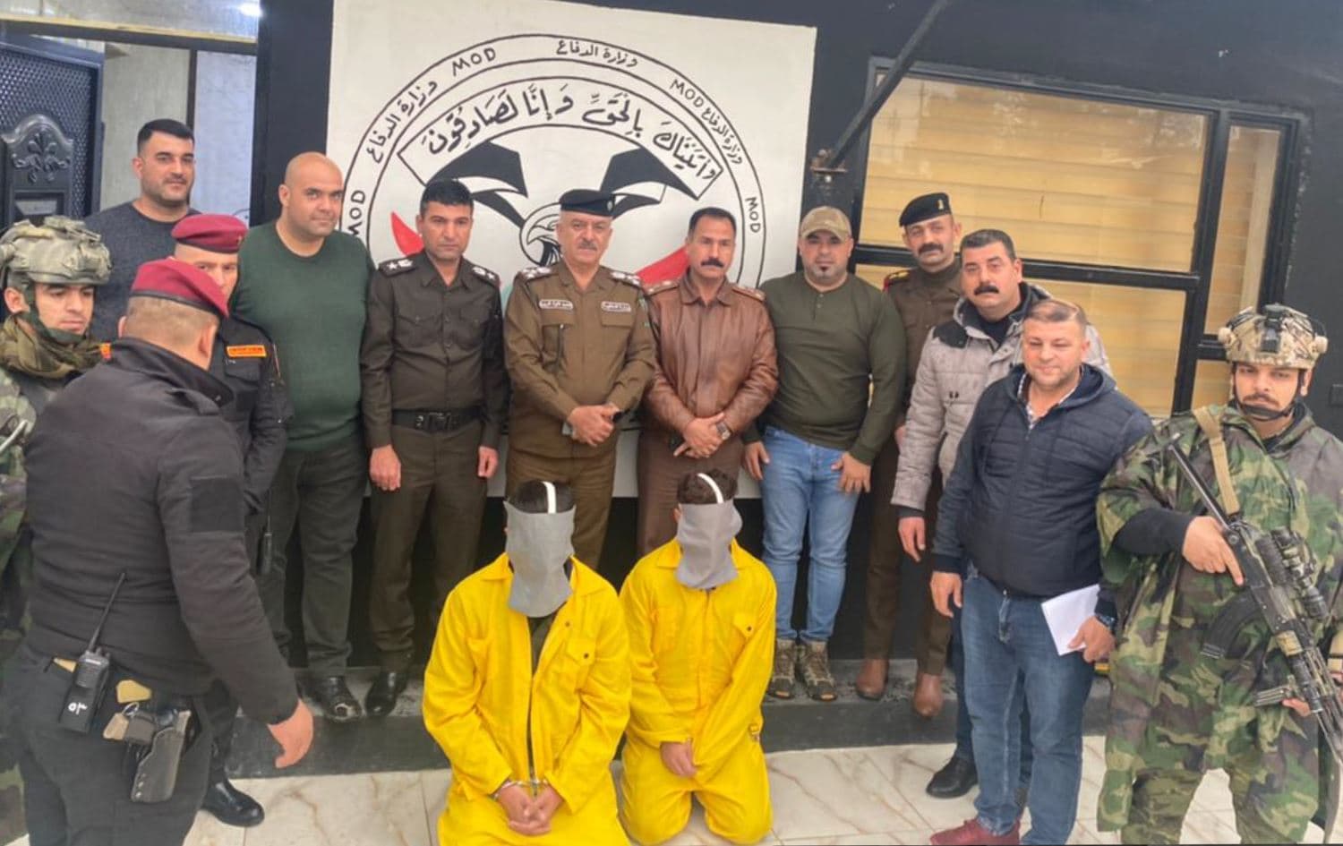 Kirkuk police arrested two people (in yellow) in relation to death of Maria. Date: March 9, 2022. Photo: handout 