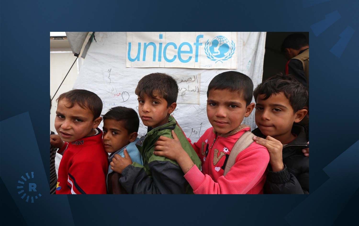 Displaced Iraqi children queue up outside a school funded by UNICEF. Photo: AFP