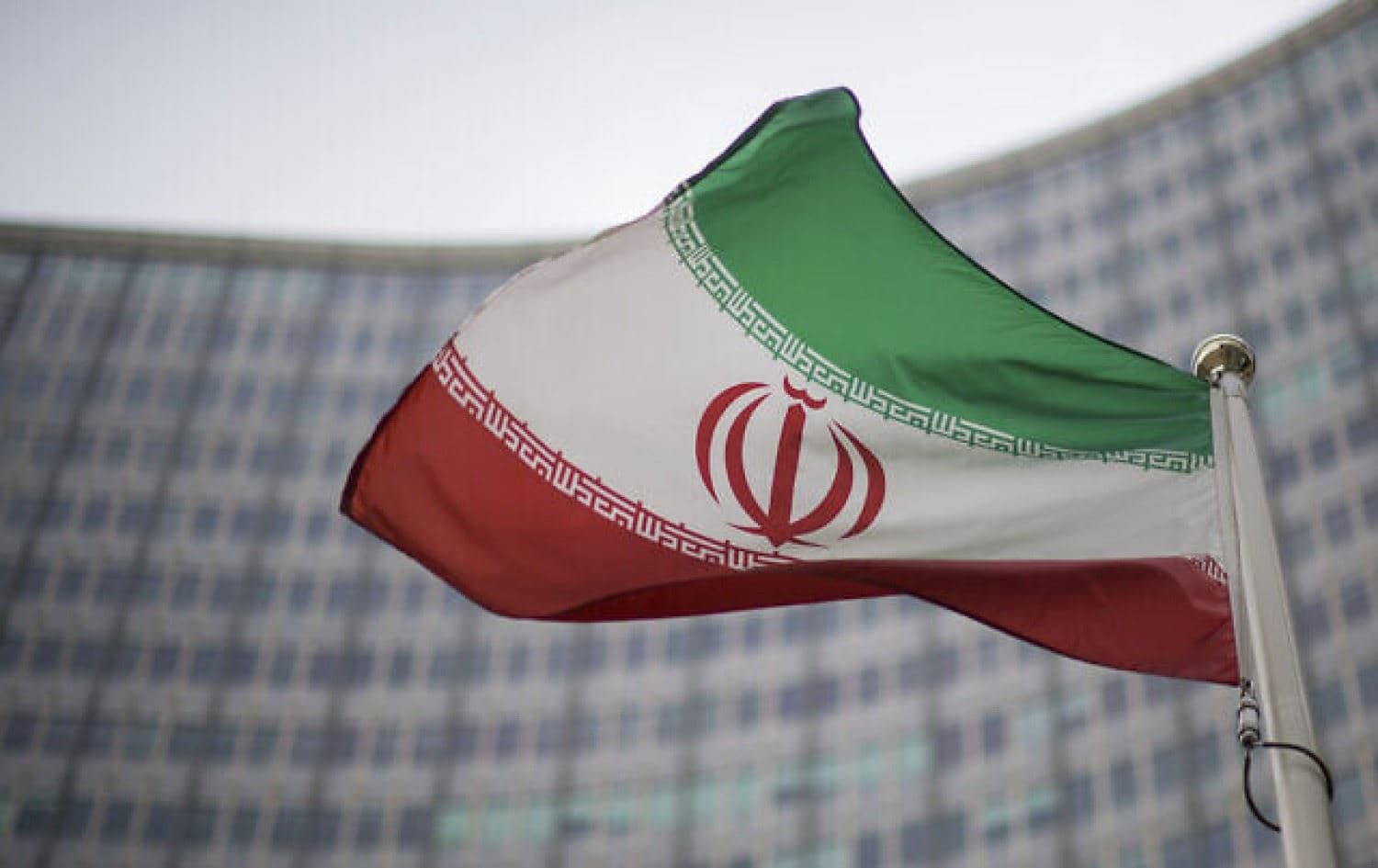Iranian flag waves in front of the building of the International Atomic Energy Agency, IAEA, in Vienna, Austria, Friday, Dec. 17, 2021. File photo: AP