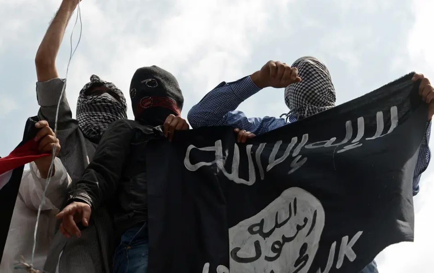 Demonstrators hold up an Islamic State (ISIS) flag. File photo: AFP
