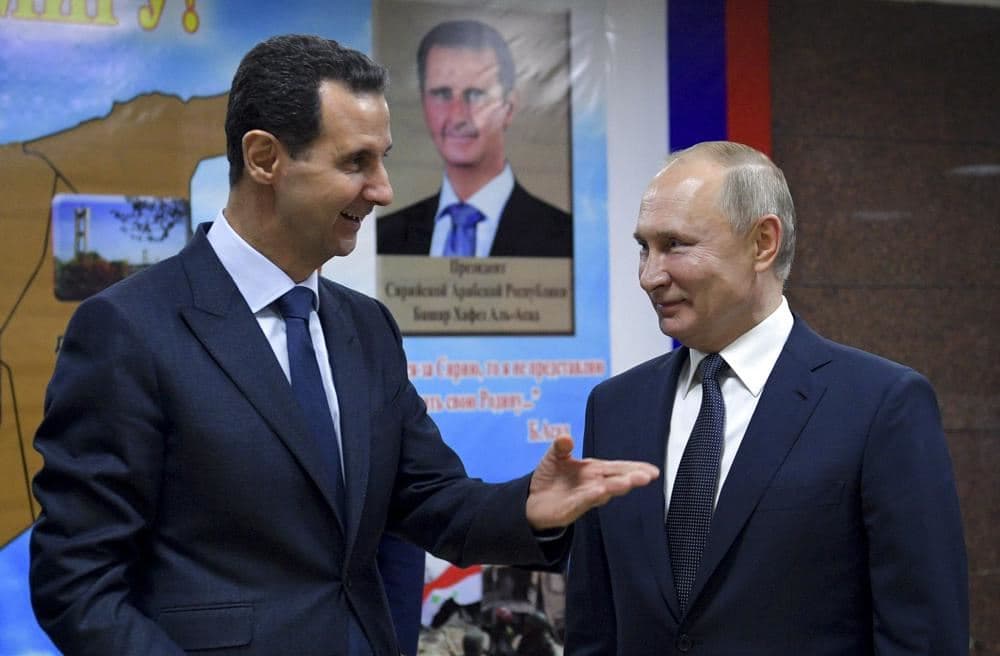 FILE - Syrian President Bashar Assad, left, gestures while speaking to Russian President Vladimir Putin during their meeting in Damascus, Syria, Jan. 7, 2020. Photo: AP 