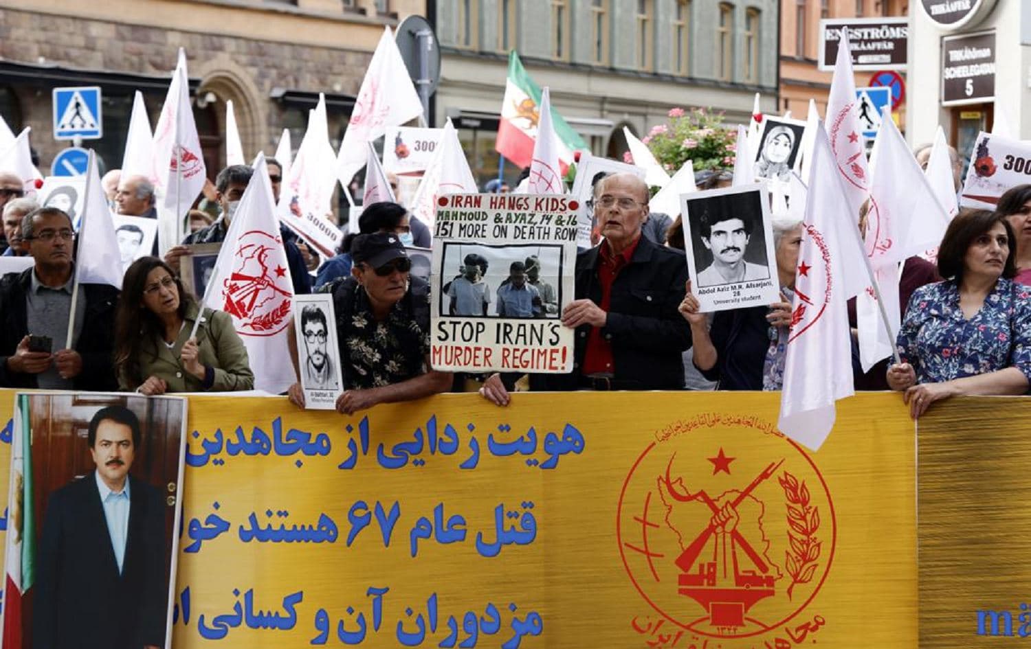 Supporters of the People's Mojahedin Organization of Iran protest outside Stockholm's district court on the first day of the trial of Hamid Noury in Stockholm on August 10, 2021. Photo: AP 