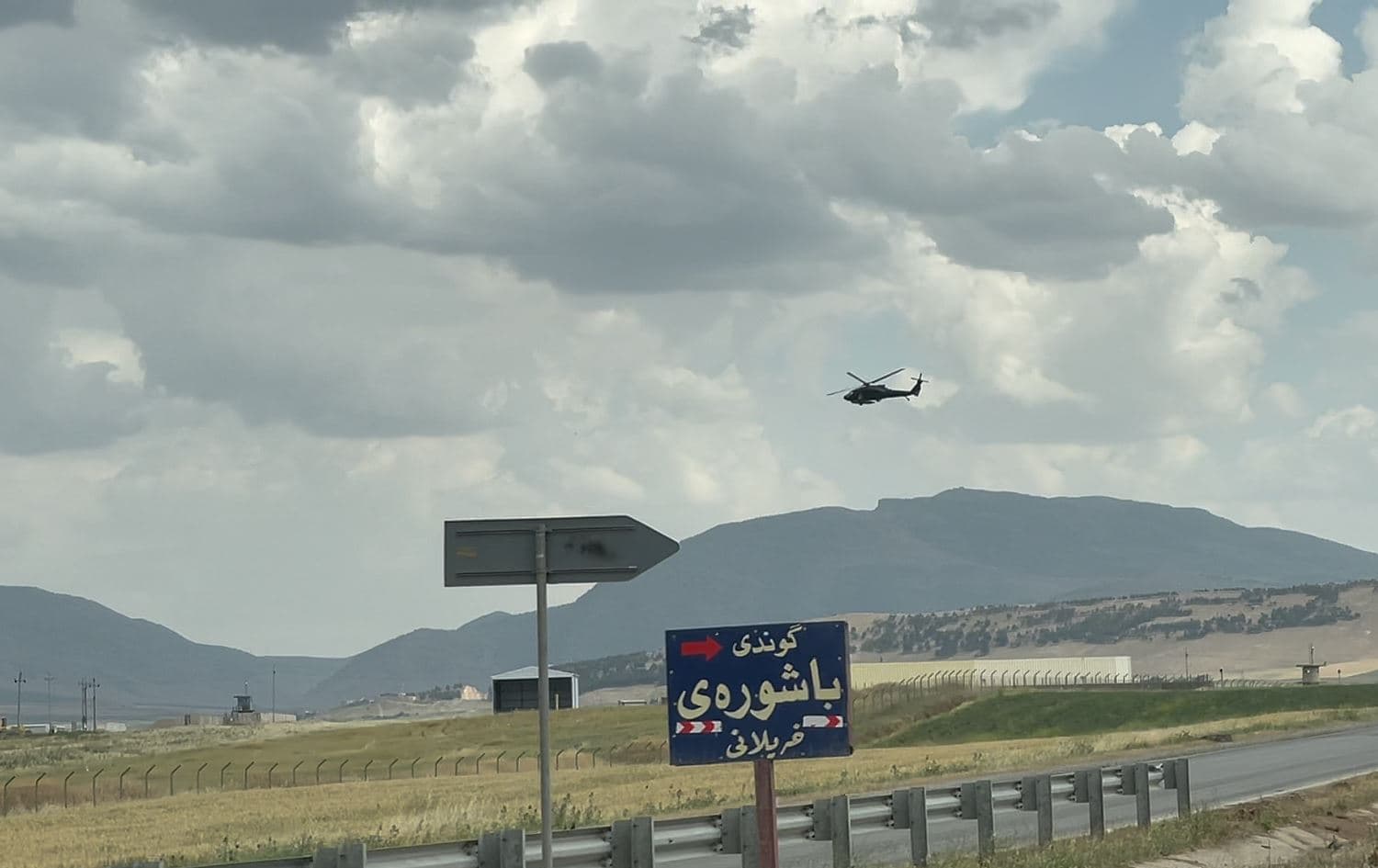 A helicopter flies over the Bashur airbase near the town of Harir in Erbil province, in May 2021. Photo: Fazel Hawramy/Rudaw