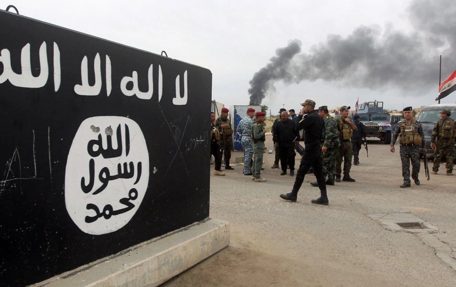 Bullet holes shown on an Islamic State (ISIS) mural. File photo: AFP