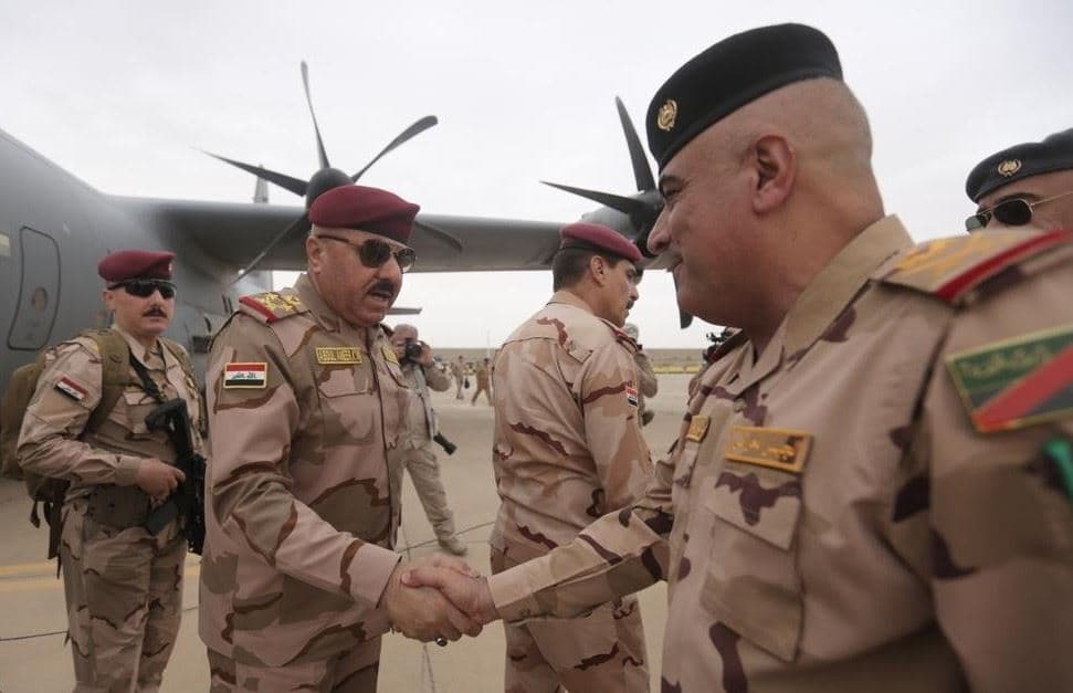 Iraqi army commanders shaking hands in Shingal. Photo: state media/file
