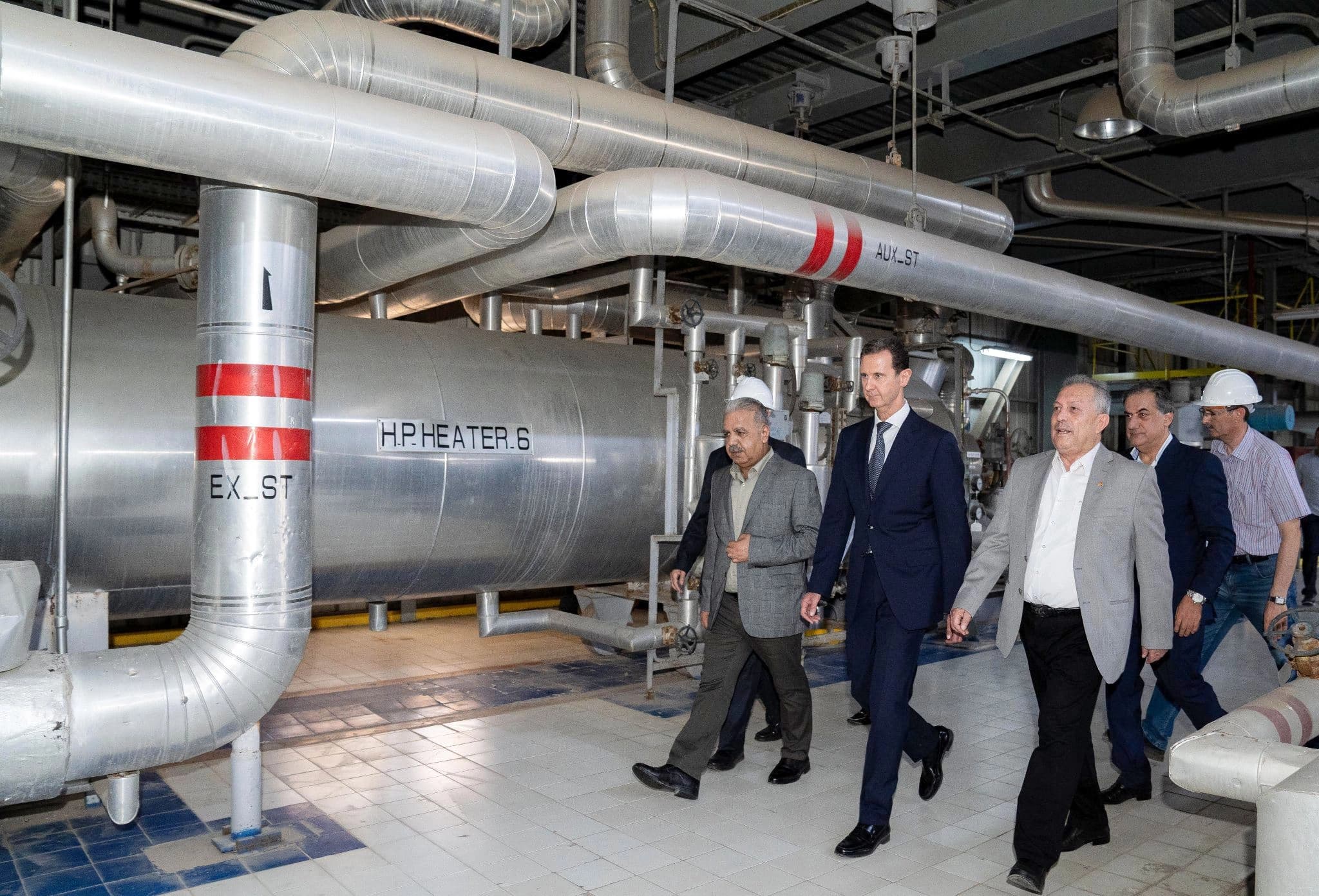 Syria's President Bashar al-Assad (C) tours a thermal power station in the eastern countryside of Aleppo province on July 8, 2022. Photo: handout/Syrian presidency 