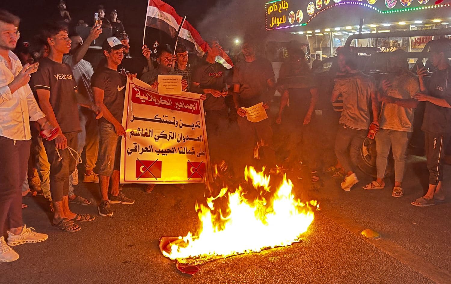 Iraqis protest Zakho's bombardment in front of a Turkish visa center in Karbala. Photo: Mohammed Sawaf/AFP
