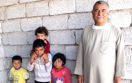 Salam with his younger siblings and uncle. Photo by Judit Neurink