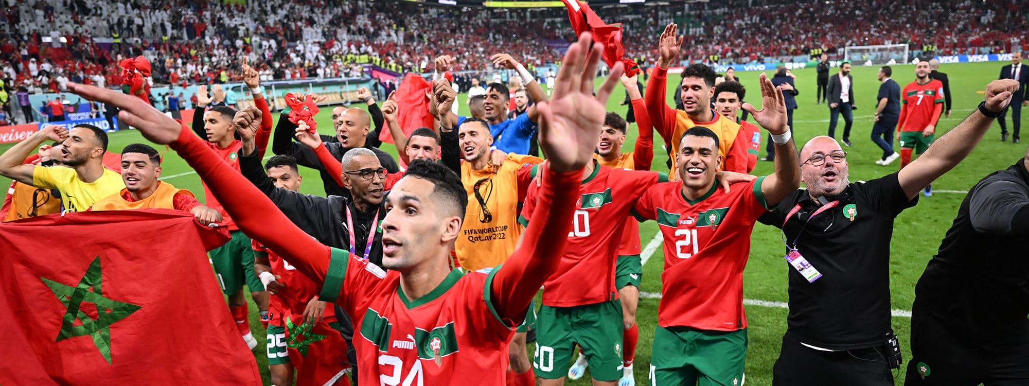 Morocco players celebrate with their supporters after they won the Qatar 2022 World Cup quarter-final football match between Morocco and Portugal at the Al-Thumama Stadium in Doha on December 10, 2022. Photo: Kirill Kudryavtsev/AFP