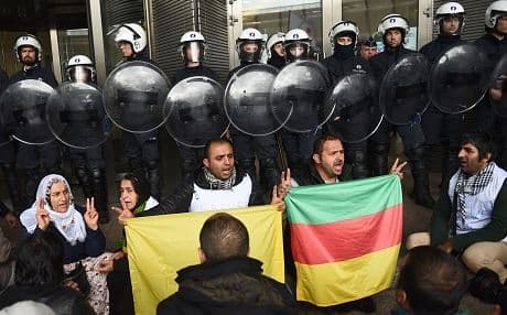 Kurdish protesters demand European action over Kobane at a demonstration outside the European Parliament in Brussels on Tuesday. Photo: AFP.