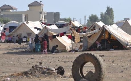 Tens of thousands of Yezidis live in tents like these in the squalor of the camp. Photo: Iraqi Red Crescent Society.