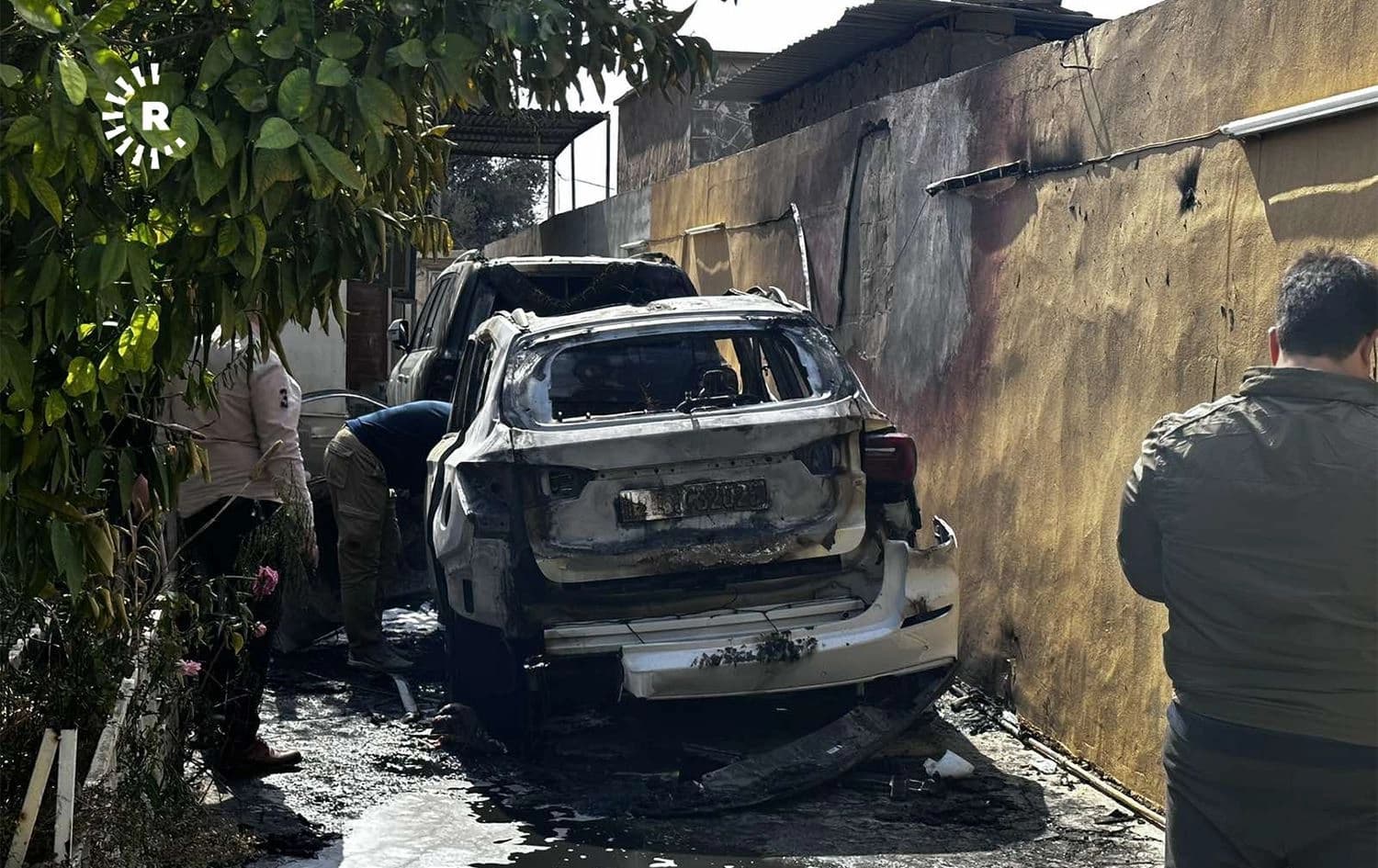 The scorched car of a former security chief of the Iraqi Turkmen Front who his party said was assassinated in Kirkuk on March 3, 2023. Photo: Hiwa Hussamadin/Rudaw