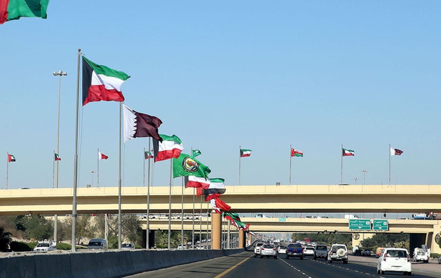 Flags of the member states of the Gulf Cooperation Council (GCC) are seen on a highway in Kuwait City on December 3, 2017. Photo: AFP
