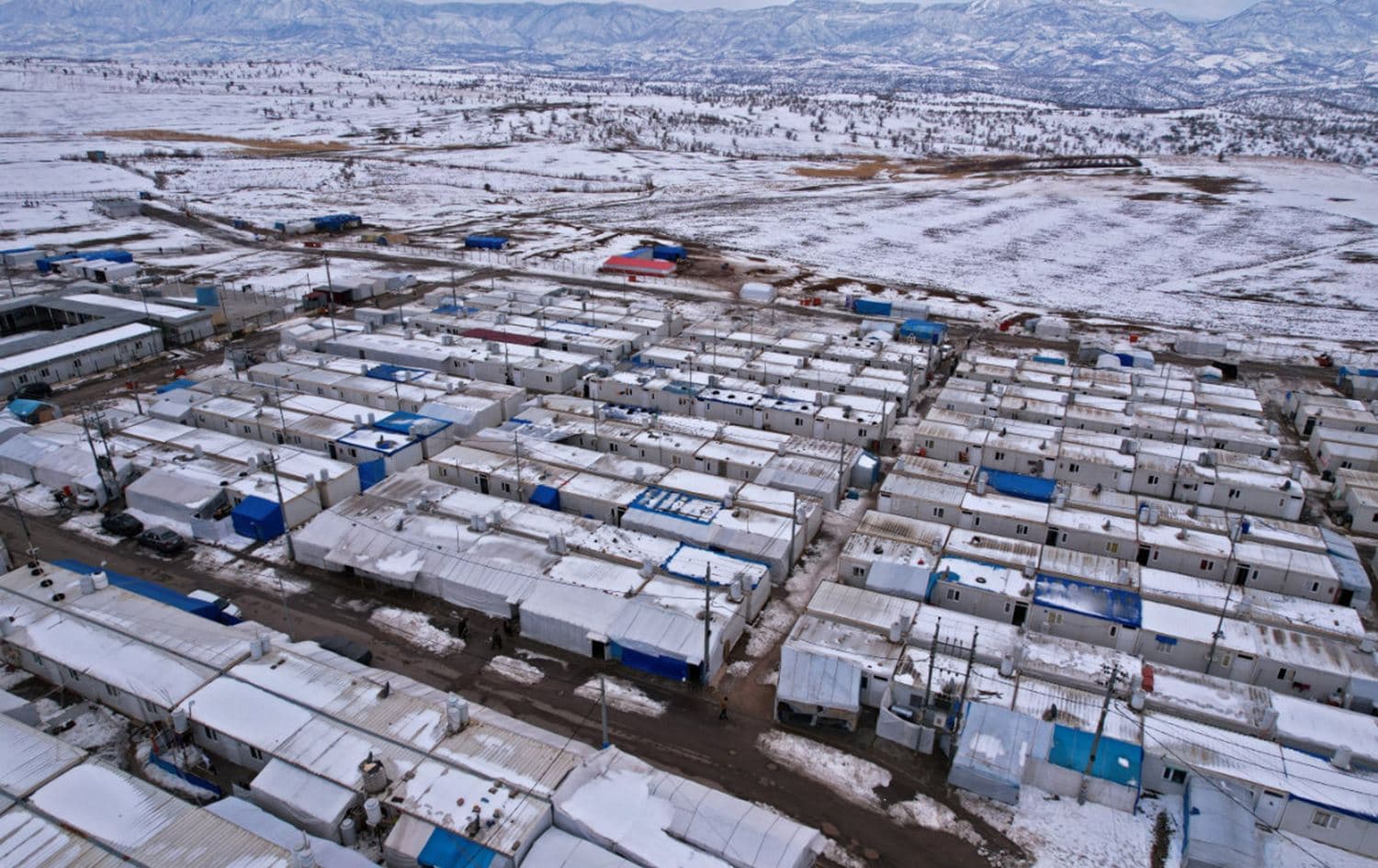 An aerial view shows a snow covered displacement camp for Yazidi people in the area of Dawudya, about 60 km north of Duhok in the Kurdistan Region on January 25, 2022. Photo: AFP