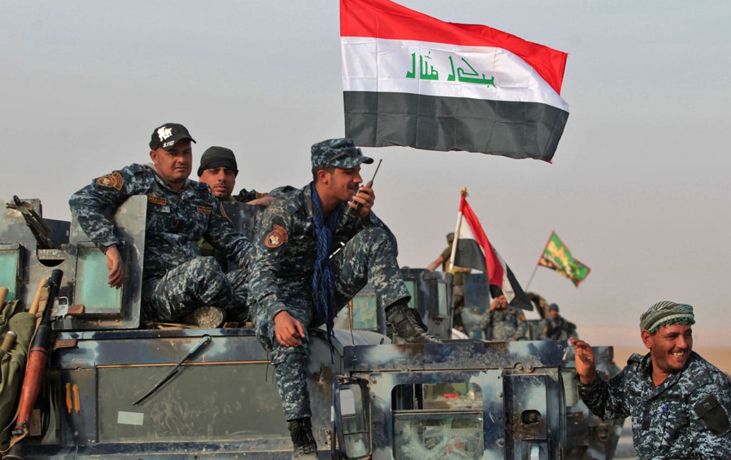 Iraqi forces hold a position near the village of Arbid on the southern outskirts of Mosul. Photo: AFP