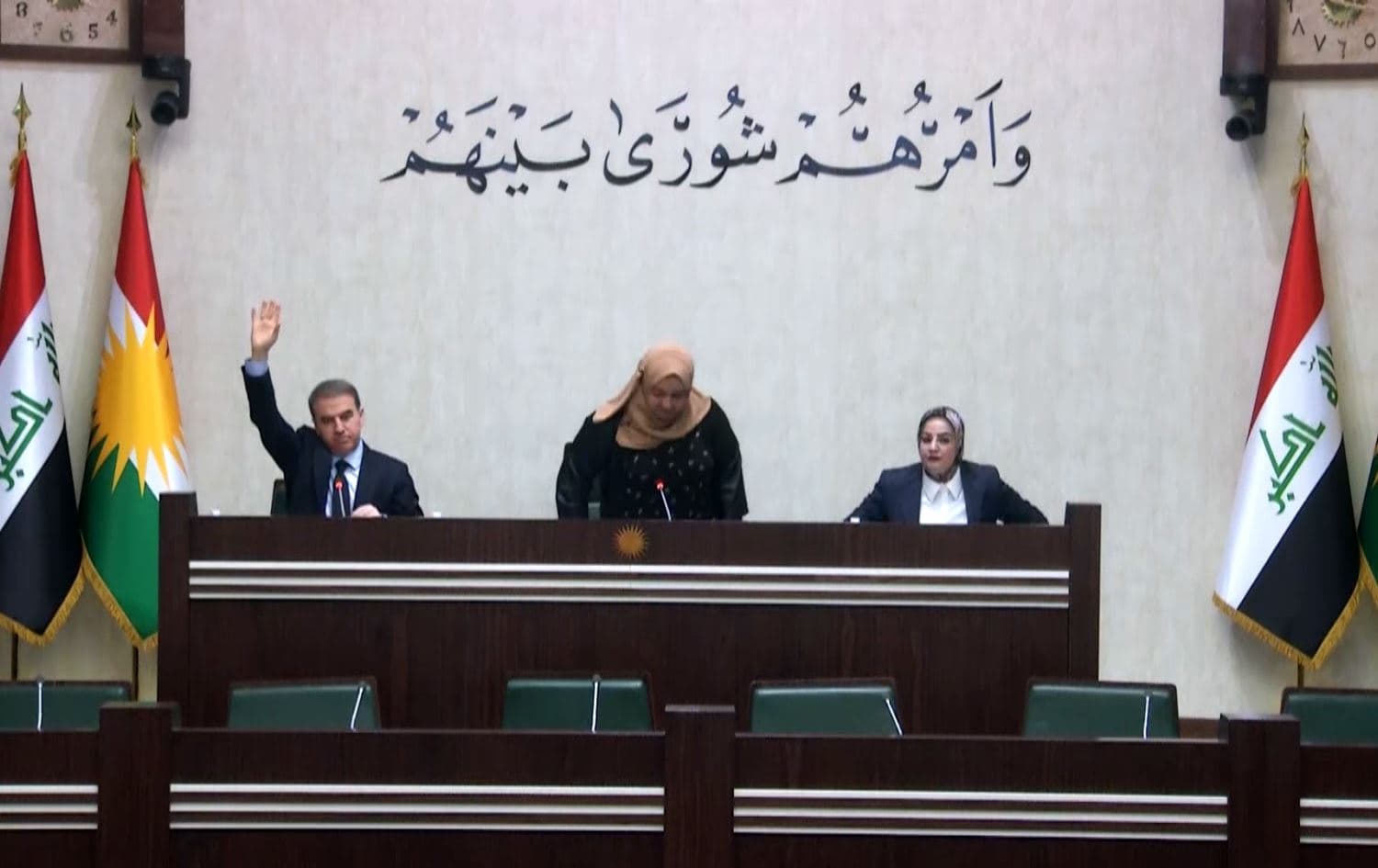 The Kurdish parliament's Deputy Speaker Hemin Hawrami (left) raises his hand in opposition as Speaker Rewaz Fayaq (center) announces adjourning the parliamentary session on May 22, 2023. Photo: Kurdistan Regional Parliament