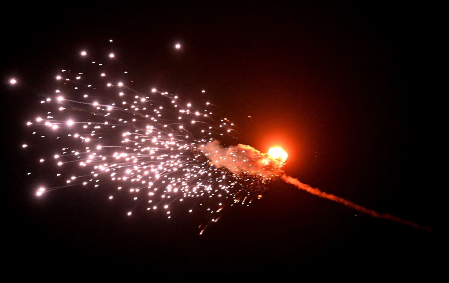 This photograph taken on May 28, 2023, in Kyiv, shows the explosion of a drone after it was shot down during a massive Russian drone strike mainly targeting the Ukrainian capital. Photo: Sergei Supinsky/AFP
