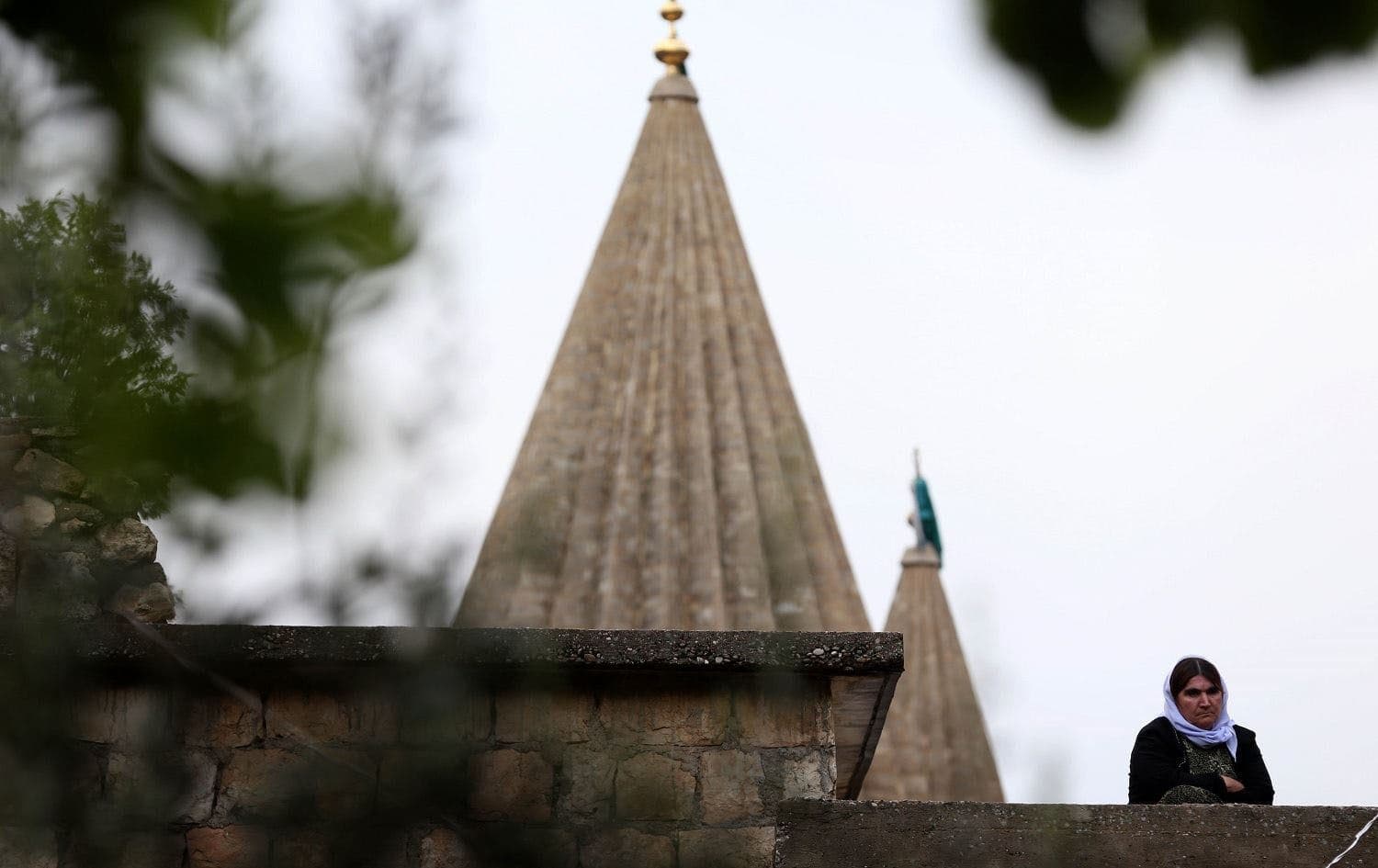 A Yazidi woman stands outside the Lalish temple in April 2015. Photo: AFP