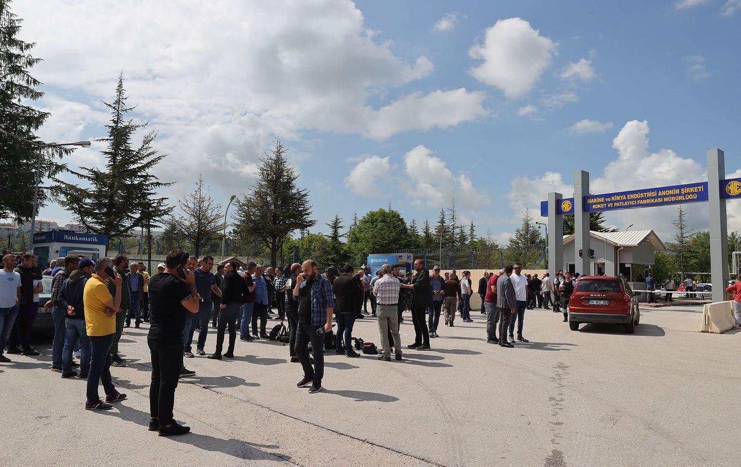 People and reporters gather outside a rocket and explosives factory where an explosion killed five workers, in Ankara, Turkey on June 10, 2023. Photo: AA
