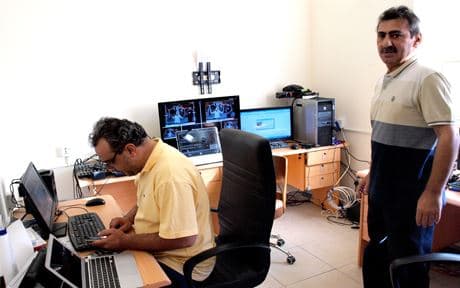 Bashar Abdullah (right) is the editor-in-chief of Naynawa al-Ghad TV.