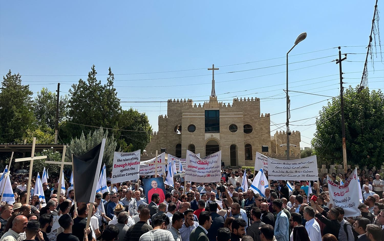 Christians gather before the Cathedral of Saint Joseph in Ankawa in solidarity with Cardinal Louis Raphael Sako to protest Iraqi President Abdul Latif's decision to revoke the special presidential decree that granted him powers over Christian affairs on July 13, 2023. Photo: Julian Bechocha/Rudaw