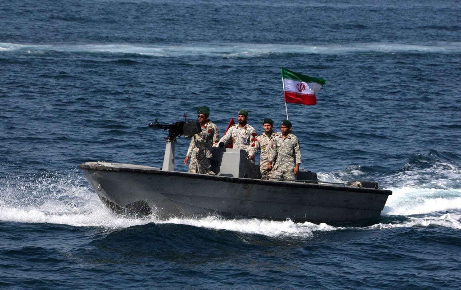 Iranian military personnel ride in a patrol boat in the Strait of Hormuz. Photo: AFP