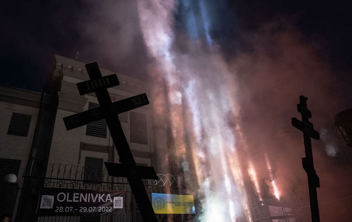 This photograph taken on July 29, 2023, shows a spotlight projected up to the sky in memory of killed Azov members during a memorial event in front of the closed Russian Embassy in Kyiv, marking one year anniversary of the Olenivka prison attack. Photo: Roman Pilipey/AFP