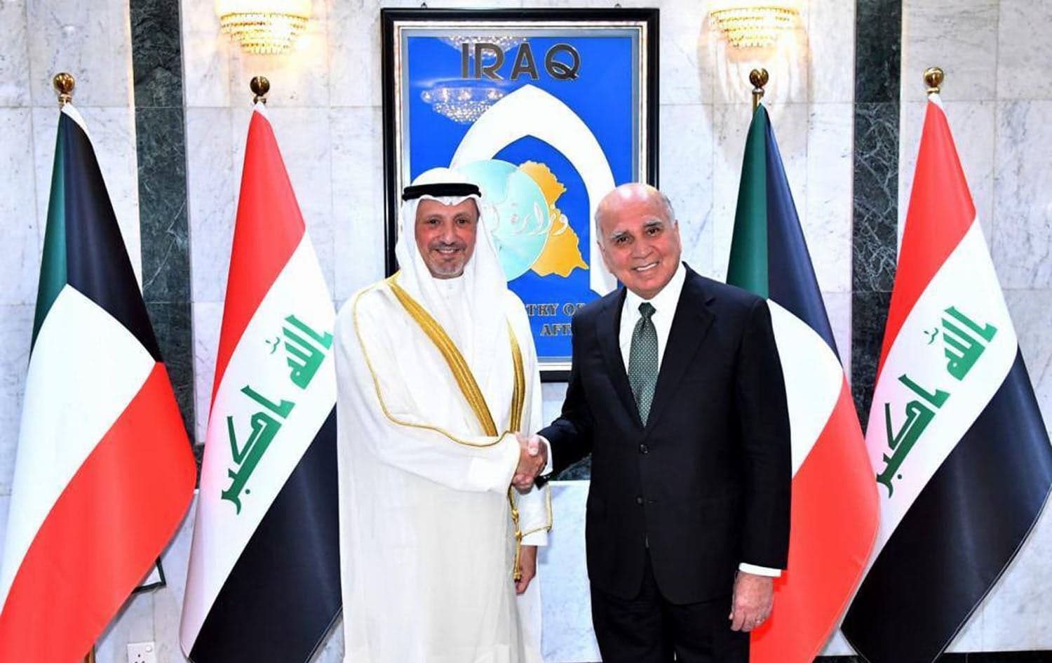 Kuwaiti Foreign Minister Salem Abdullah Al-Jaber Al-Sabah (left) and his Iraqi Counterpart Fuad Hussein in Baghdad on July 30, 2023. Photo: Handout/Iraqi foreign ministry